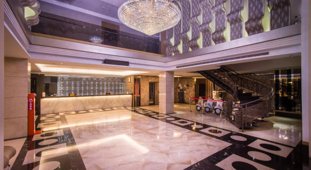 Кровать в общем номере Esun Villa Hotel