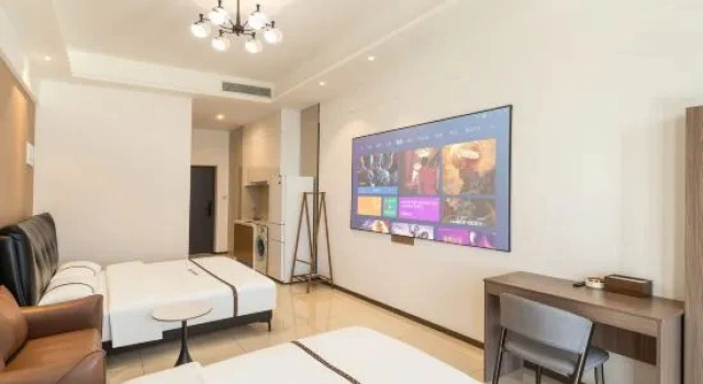 Кровать в общем номере Meet the Sea · Scenic Resort Apartment