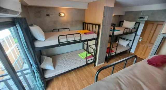 Кровать в общем номере MA PEAK hotel