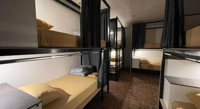 Pat în dormitor Ñañas Hostel