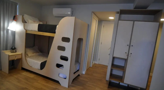Кровать в общем номере Porto Velho Boutique Lodge