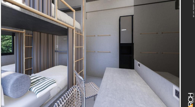 Кровать в общем номере Rucksack Inn Siargao