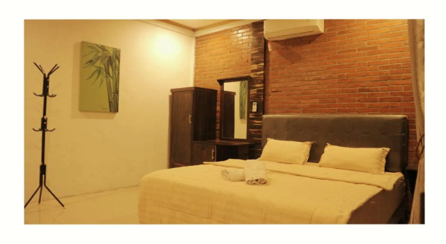 Кровать в общем номере Wanajaya Homestay by ABM
