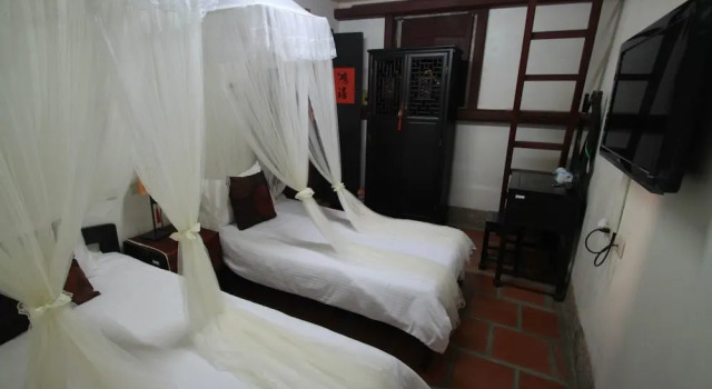 Четырёхместные апартаменты Tan Gu Shou Jin Guesthouse 1