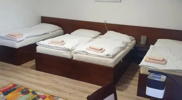 Кровать в общем номере Penzion PKO Nitra