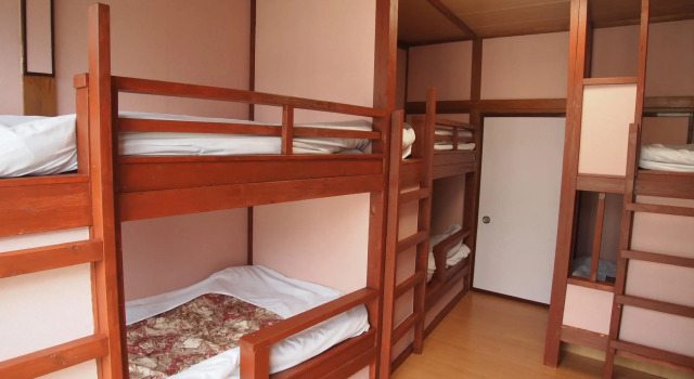 Кровать в общем номере Hotel Nikko-Kinugawa Inn Miyasaki