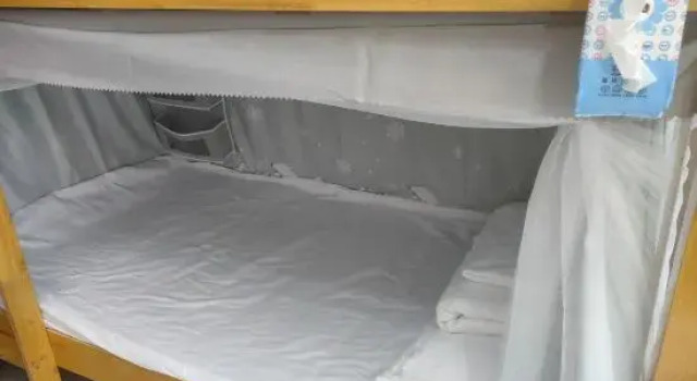 Кровать в общем номере Haikou East Railway Station Boutique Homestay