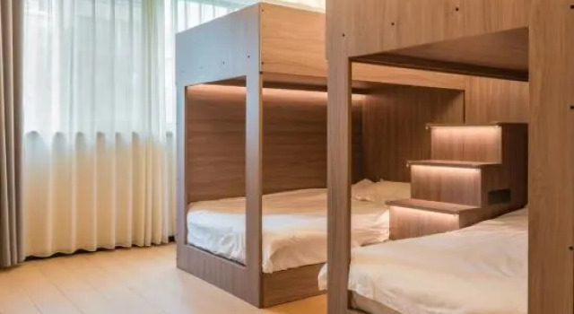 Кровать в общем номере WanYoo Esports Hotel (Yixing Huanke Park Gui Street)