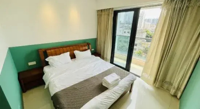 Кровать в общем номере с видом на море Beihai Huanan Thematic Scenic Apartment (Beihai Golden Beach Beibu Bay No.1)
