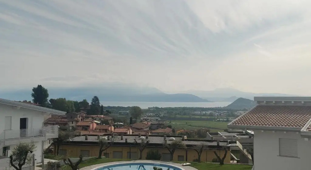 Апартаменты Bilocale in residence vista lago con piscina