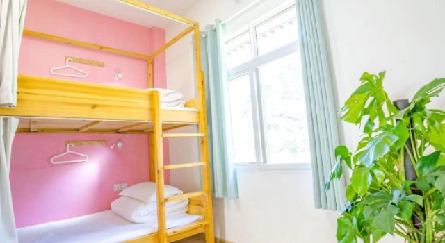 Кровать в общем номере Xiaoyaota Inn Jiuzhaigou