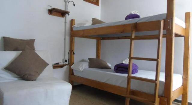 Кровать в общем номере La casita de Estrella