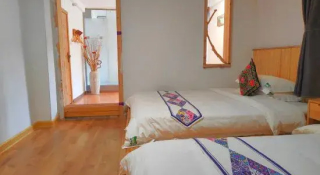 Кровать в общем номере Zhaoping Huangyao Town Poya Inn