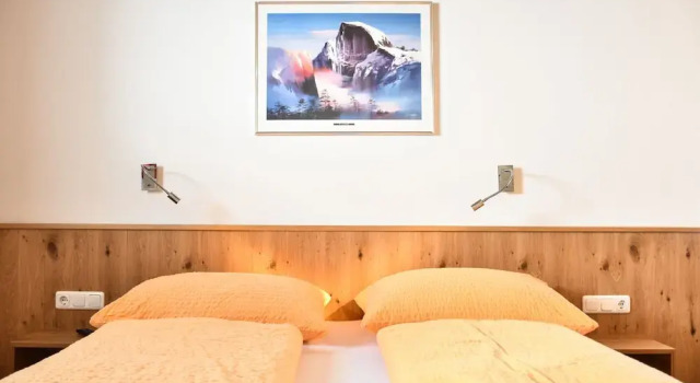 Четырёхместные апартаменты с балконом и с видом на горы Haus Alpenblick