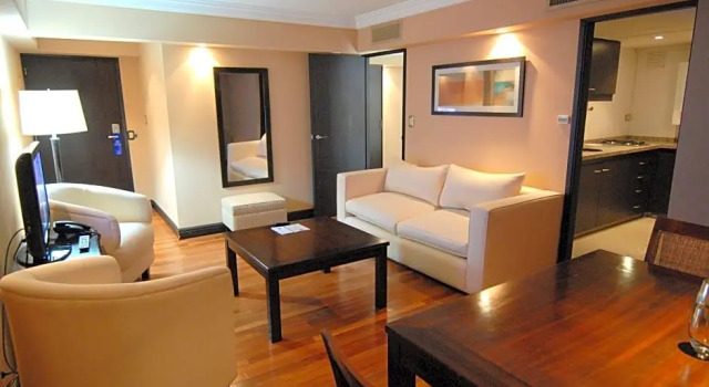 Кровать в общем номере Premium Tower Suites Mendoza