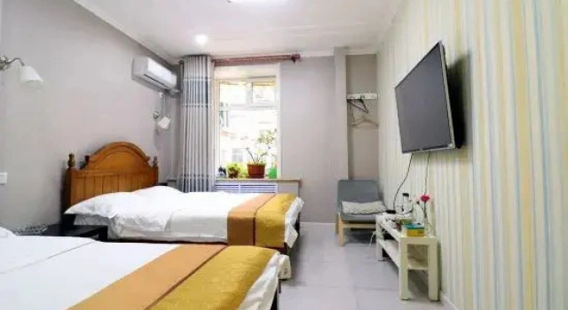 Łóżko w pokoju wieloosobowym Huayi Hostel