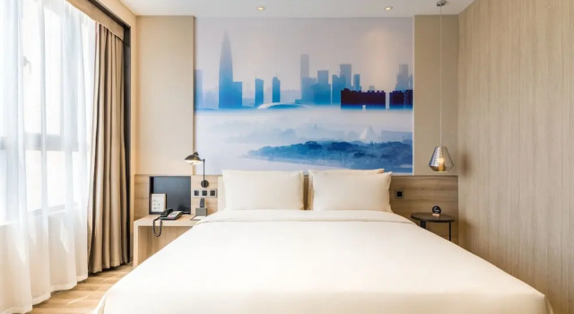 Номер Deluxe Green Oriental Hotel (Shenzhen Pinghu South China City Hehua subway station)