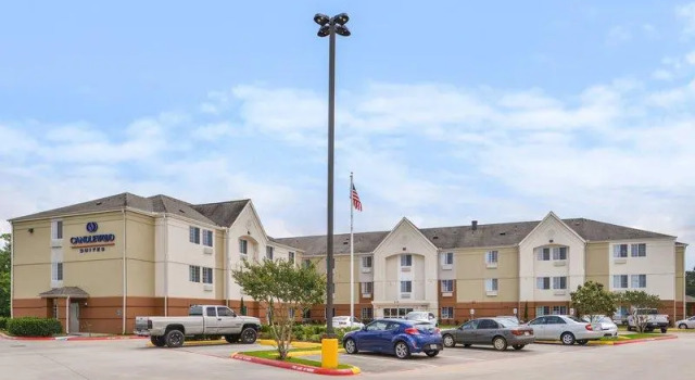 Кровать в общем номере Candlewood Suites Beaumont by IHG