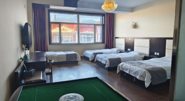 Кровать в общем номере Xiwuqi Jindi Hotel