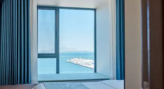 Люкс с 2 комнатами с видом на море Yuepeng Boutique Apartment (Dalian Harbour Plaza)