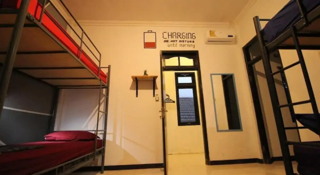 Łóżko w pokoju wieloosobowym Hati-Hati Homestay