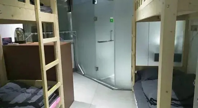 Кровать в общем номере hangzhouaiyizuocheng Inn