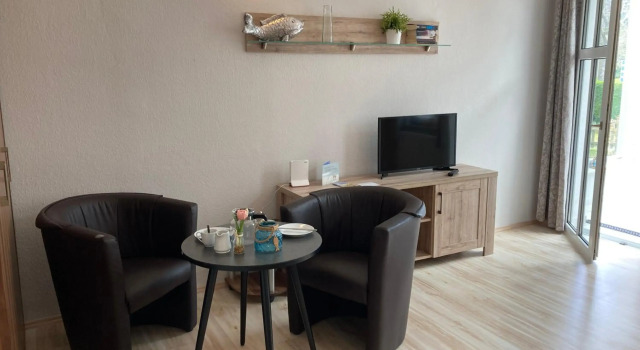 Ferienwohnung 4 Rosenbogen - Familienwohnung mit Wintergarten und Terrasse