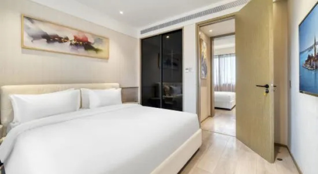 Люкс Deluxe с 2 комнатами с балконом Shanghai Yusen Hotel (Shanghai Pudong Fudan Cancer Hospital Kangxin Highway Subway Station Branch)