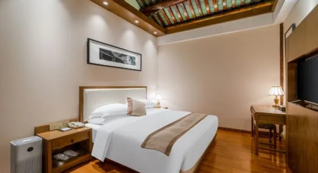 Кровать в общем номере Nantong GINLAN JIA Tangzha Impression Hotel