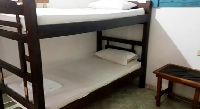 Кровать в общем номере Oasis Hostal Restaurante