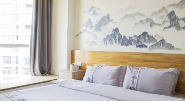 Люкс Tuman Jiuqi Hotel (Leshan High-speed Railway Station Wanda Plaza)