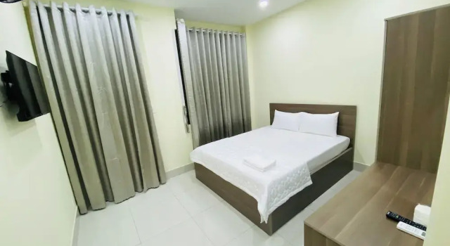 Номер Deluxe Khach San Gia Thanh
