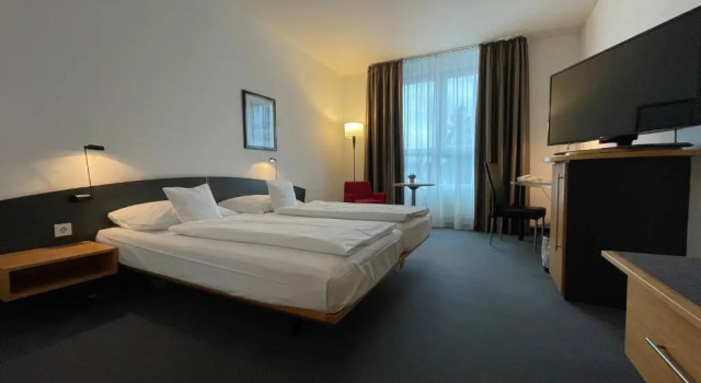 Четырёхместный номер Standard PLAZA INN Heidehof