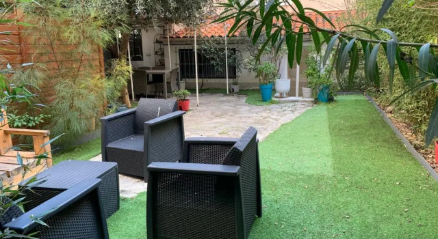 Апартаменты Appartement avec jardin en centre ville