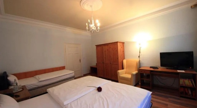 Кровать в общем номере Altstadthotel Fürth