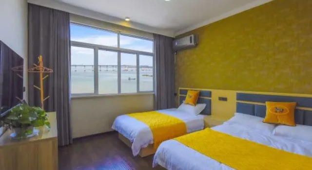 Кровать в общем номере Jun Ta Home Stay