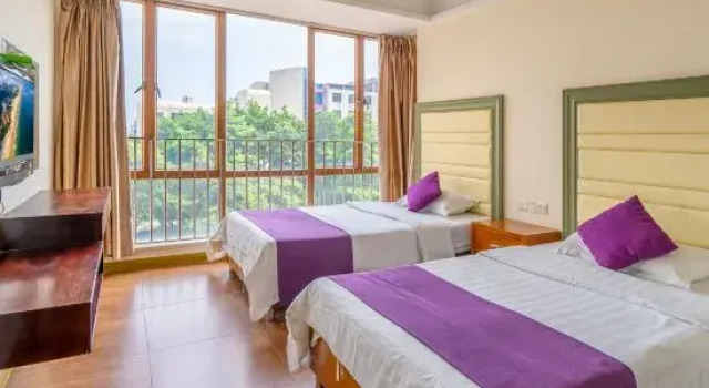 Кровать в общем номере с 3 комнатами Fengfan Resort Apartment (Zhapo Dajiaowan Water Park)