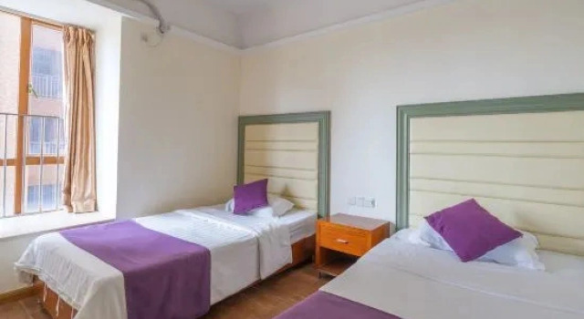 Кровать в общем номере с 3 комнатами с видом на море Fengfan Resort Apartment (Zhapo Dajiaowan Water Park)