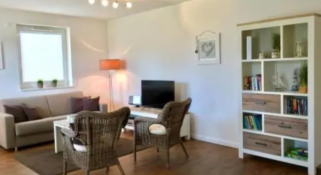 Ferienwohnung Dünenhäuser App. A2, Забронировать Отель Шарбойц Holstein Switzerland, рядом с Пляж Hundestrand