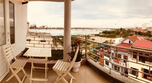 Кровать в общем номере Nam Long Hotel