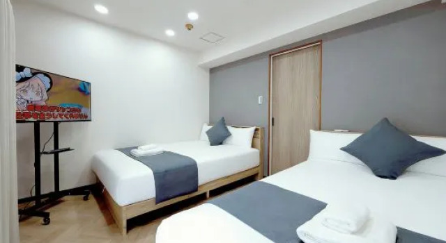 Кровать в общем номере с 2 комнатами Mudanjiang Xinle Guesthouse Second Branch