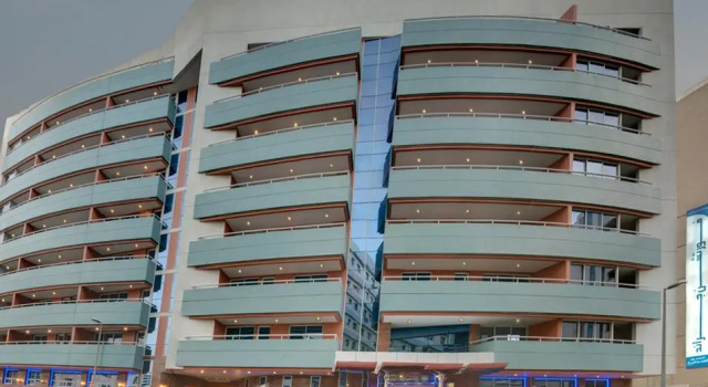 Кровать в общем номере Fortune Grand Hotel Apartment