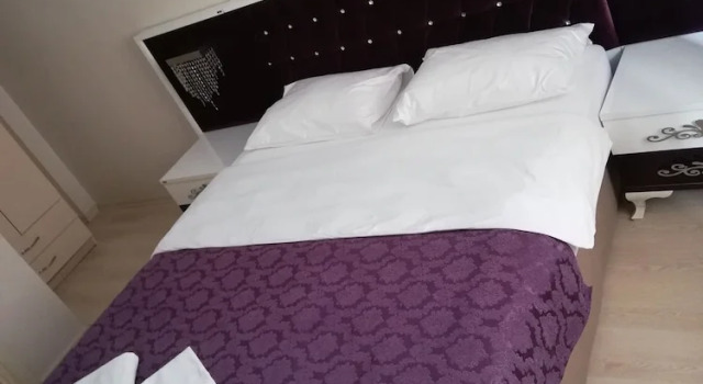Apartament 1 sypialnia i balkonem i z widokiem na ogród A Suit Residence