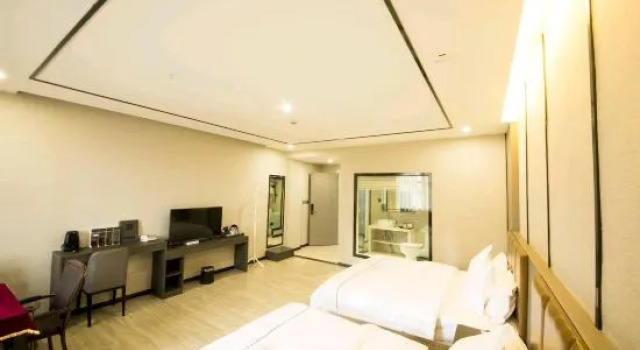 Кровать в общем номере Linyi Taiyuan Shangjing Hotel