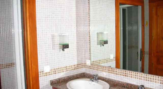 Кровать в общем номере Albergue Peña Castil