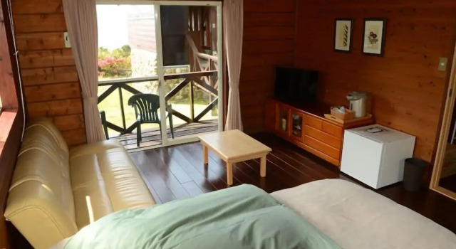Коттедж с балконом TIDA Resort Yakushima 旧 屋久島海の胡汀路てぃーだ