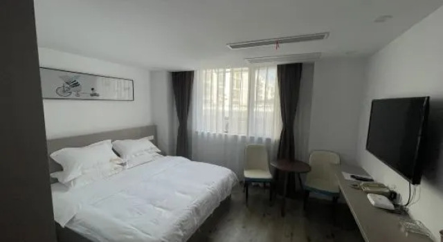 Люкс Deluxe Guannan Qianxin Business Hotel