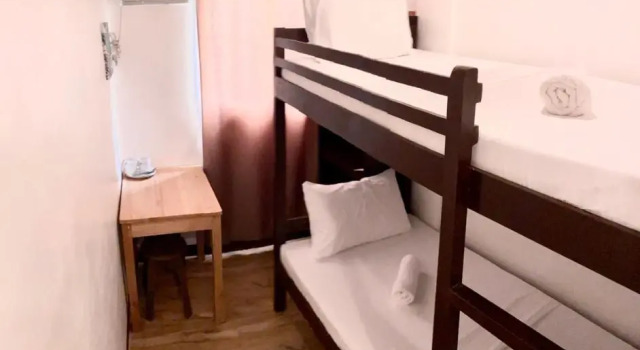 Кровать в общем номере Kampotel Davao