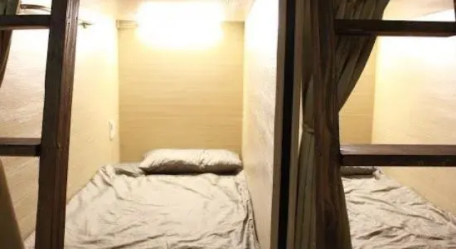 Кровать в общем номере FC Hostel-Ruifang Station
