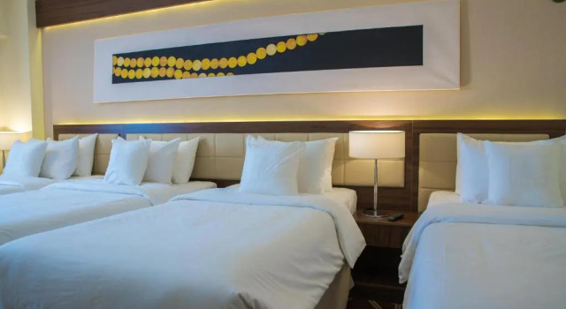 Четырёхместный номер Blue Coral Hotel